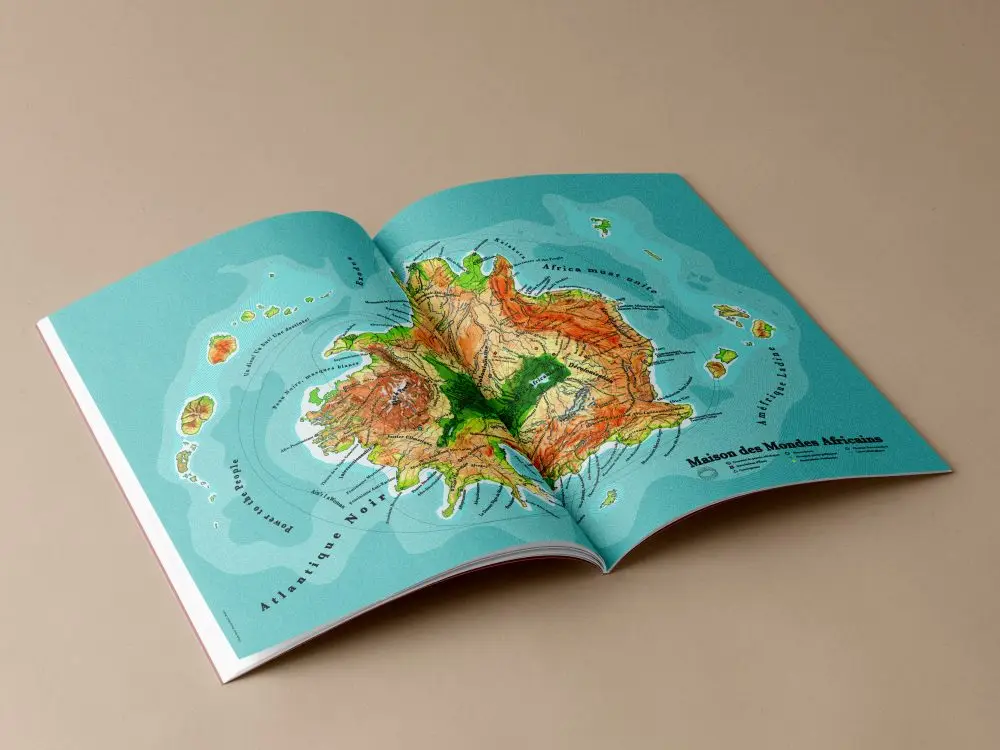 magazine ouvert présentant la carte de la maison des mondes africains